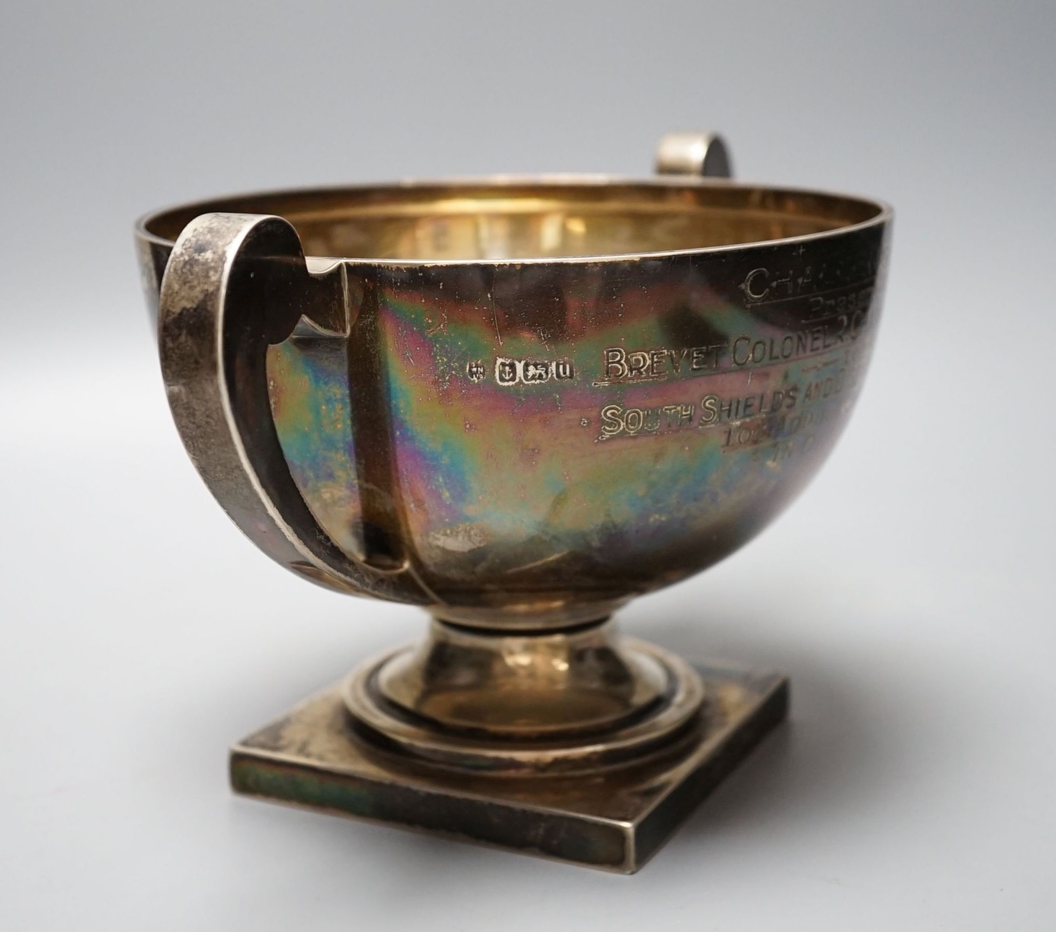 A George V silver two handled presentation trophy cup, with engraved inscription, William Neale Ltd, Birmingham, 1919, diameter 17.3cm, 19.5oz.